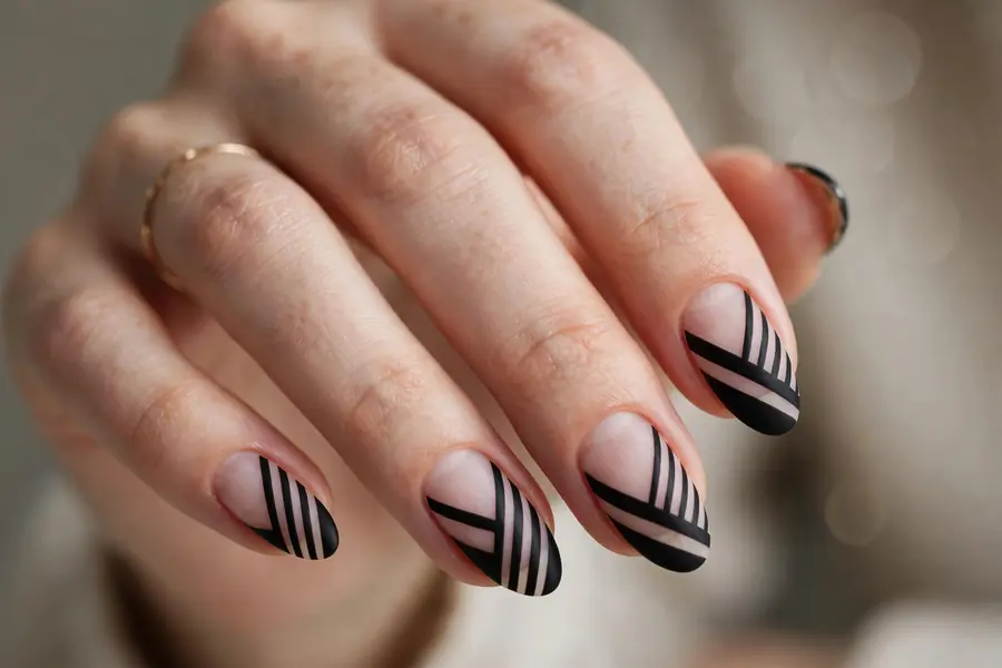 Negative space diagonal almond nails stripes on real hands