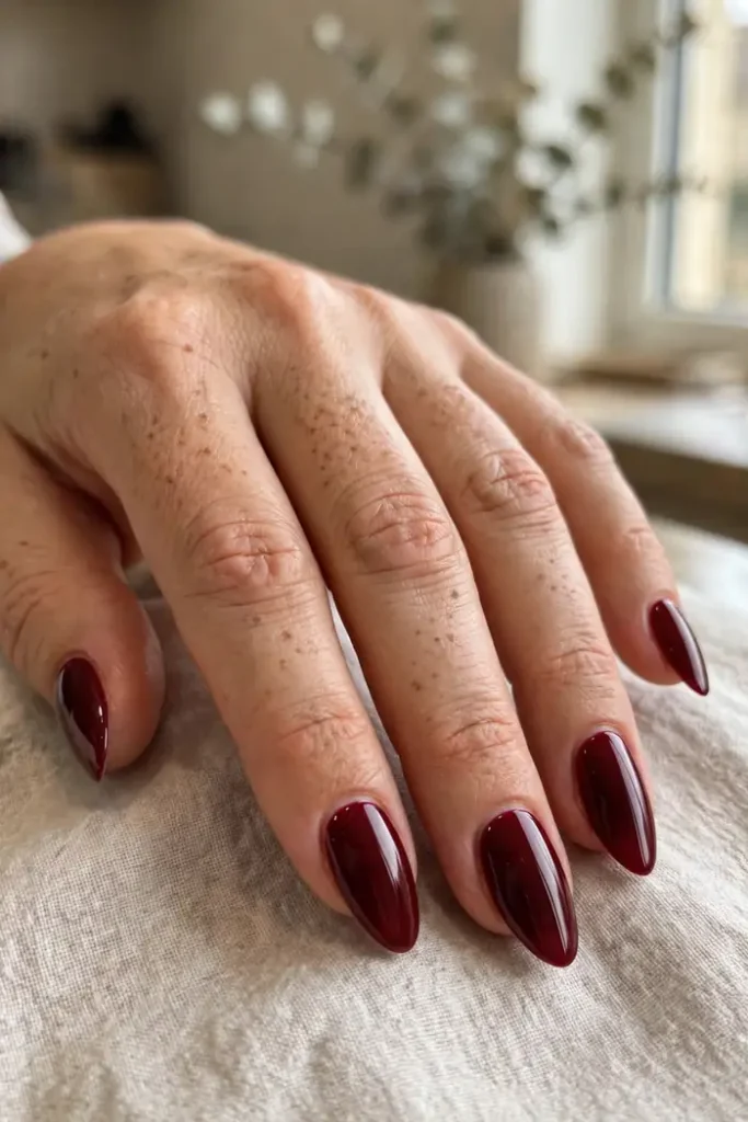 Deep red glossy almond nails