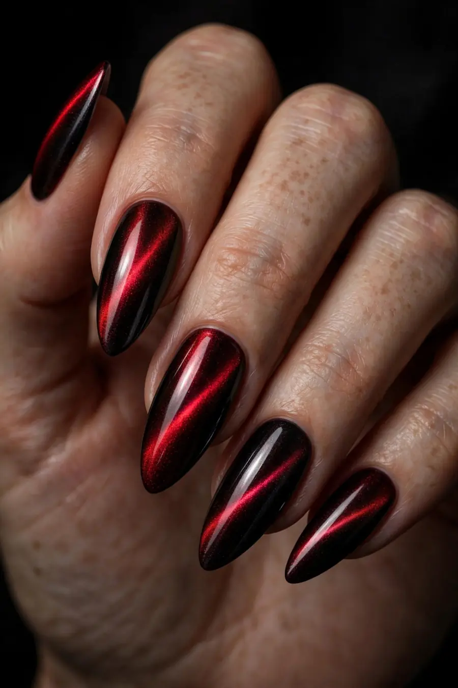 Metallic crimson dark red cat eye nails with mirror shine