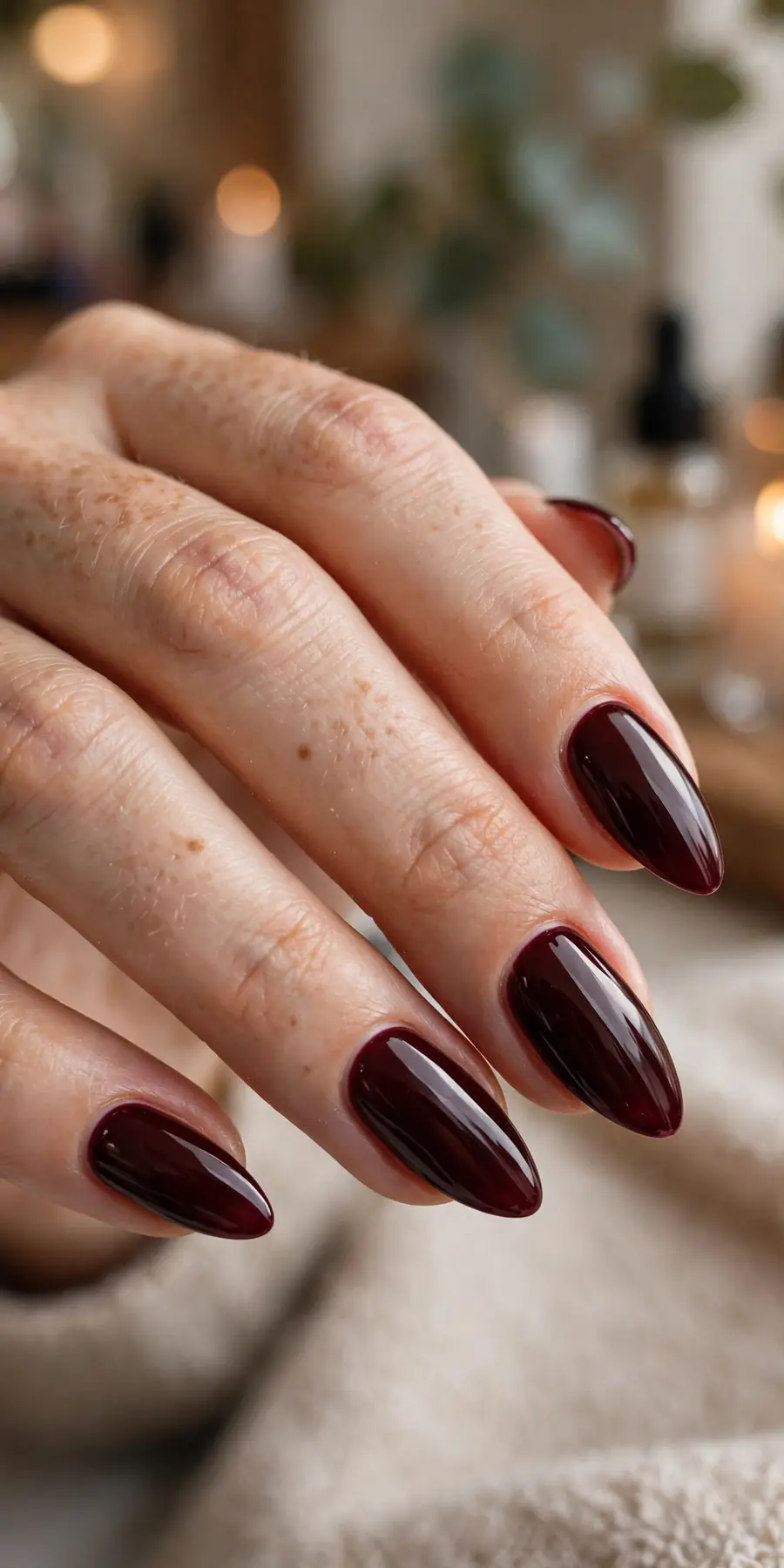Almond shaped nails in dark cherry burgundy