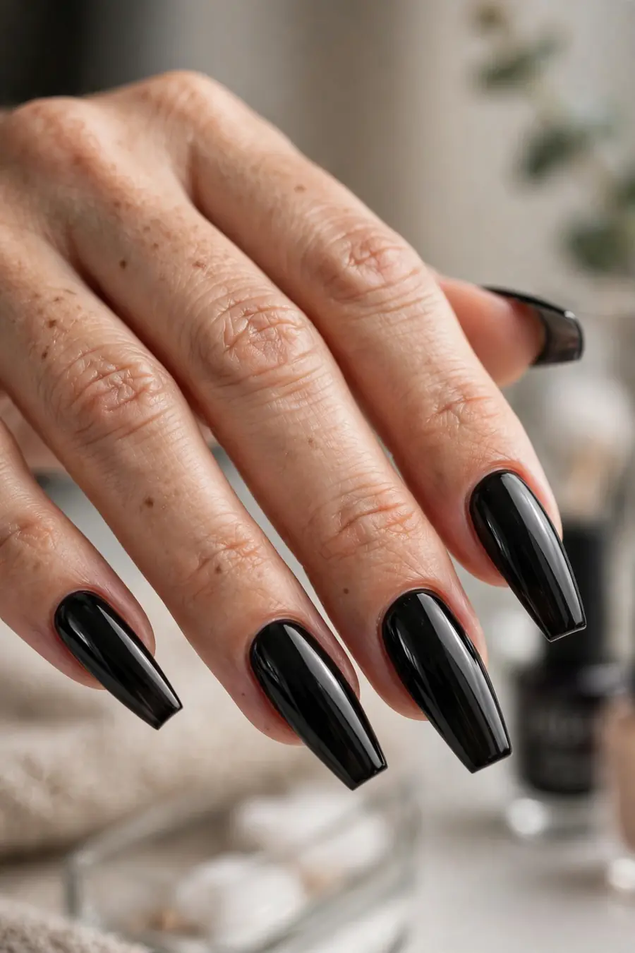 Long coffin black nails with glossy finish, dramatic black nails