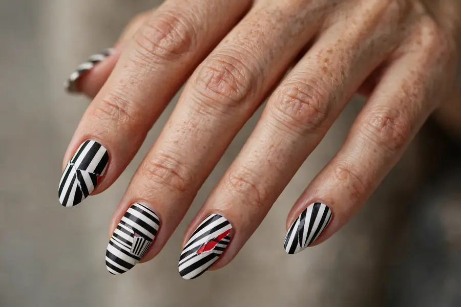 Asymmetric multicolor striped almond nails on real hands
