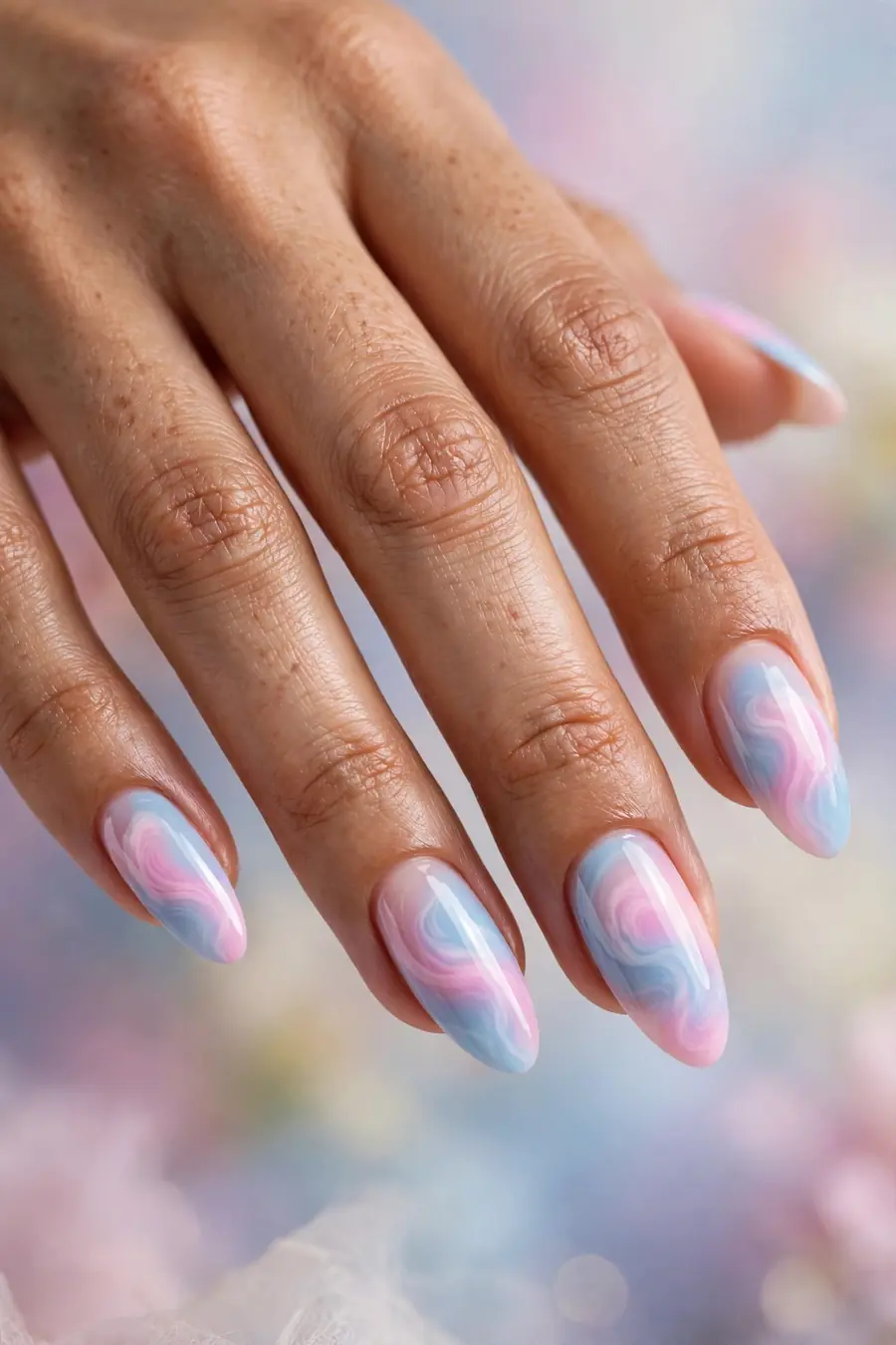 Cotton candy aura nails blending pastel pink and baby blue