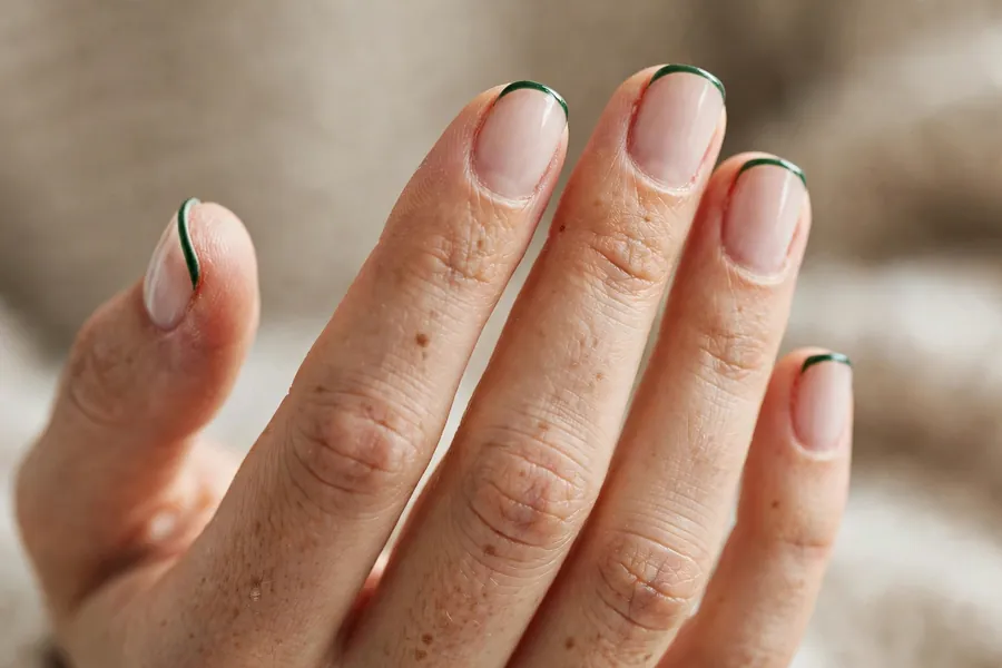 Forest green micro French tip nails