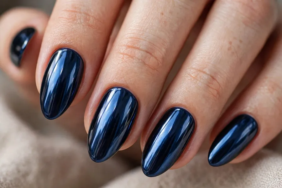 Midnight blue gothic chrome nails with electric blue glow