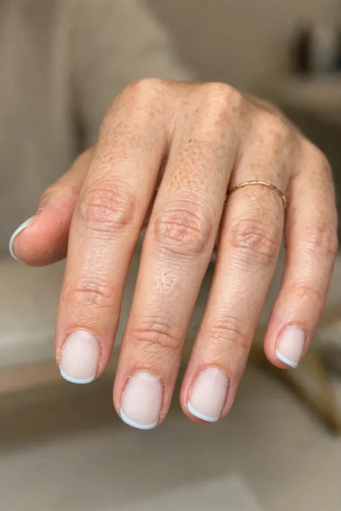Baby blue micro French tip nails