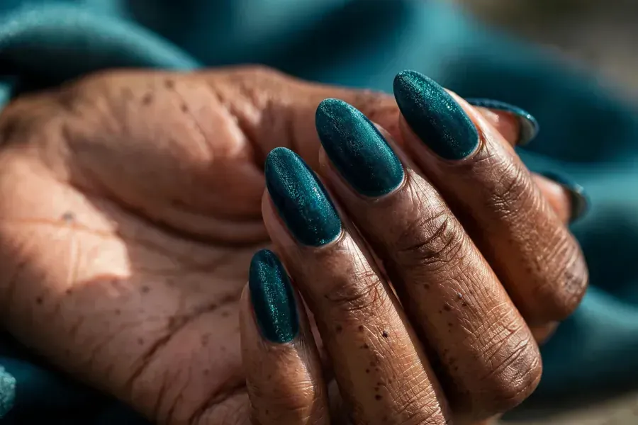 Peacock teal velvet nails on real hands