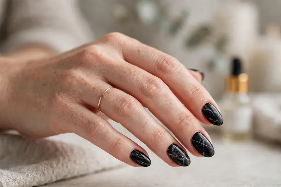 Black marble nails with white veining, smoked black nails art