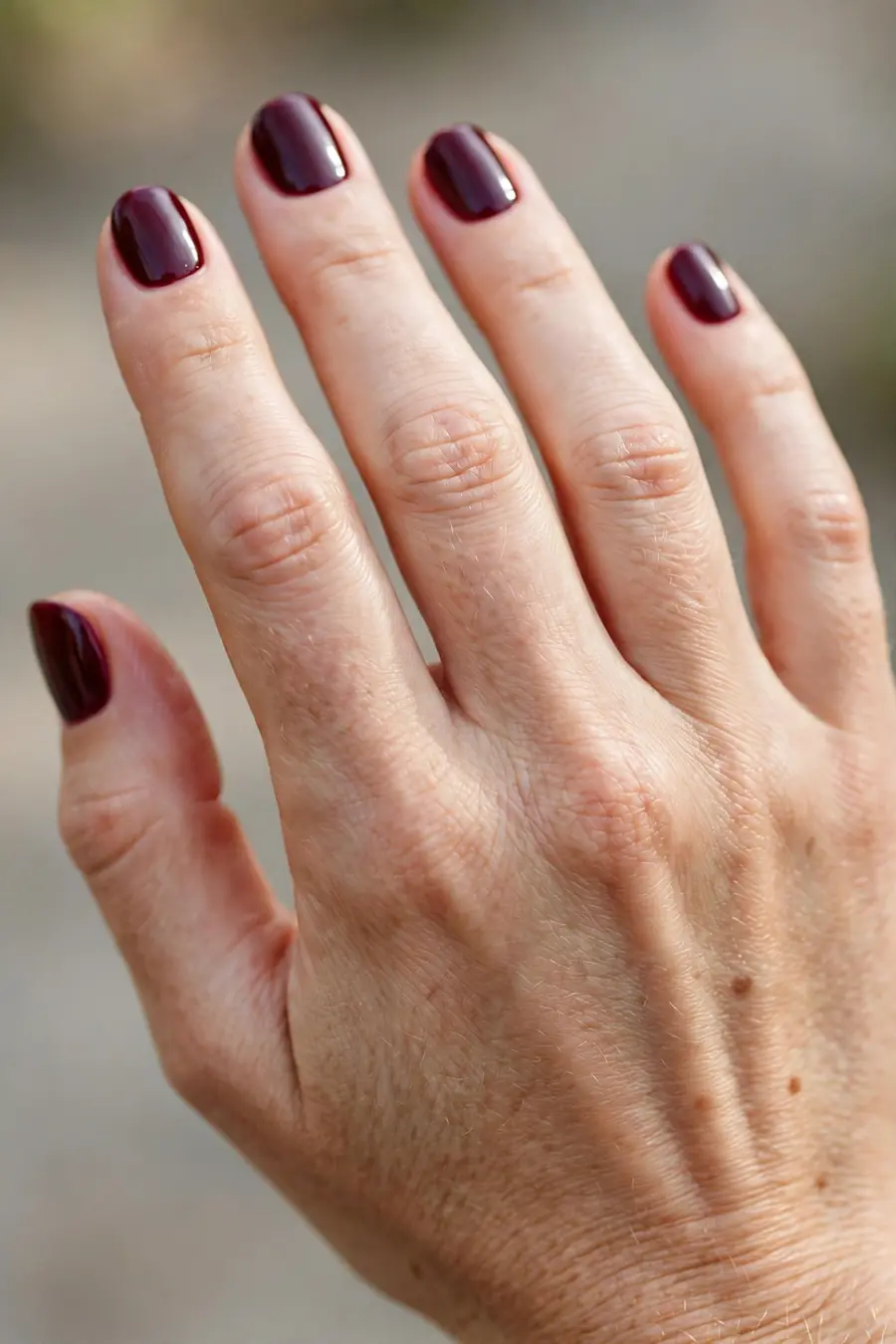 Burgundy wine short nail designs on real hands