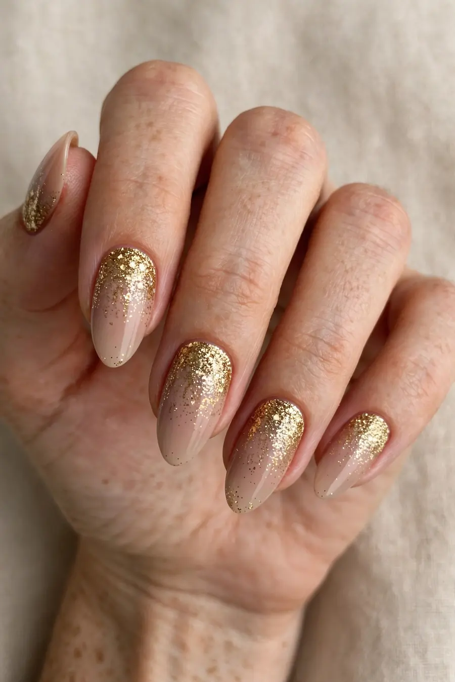 Gold glitter fade from the cuticle on New Year's Eve nails