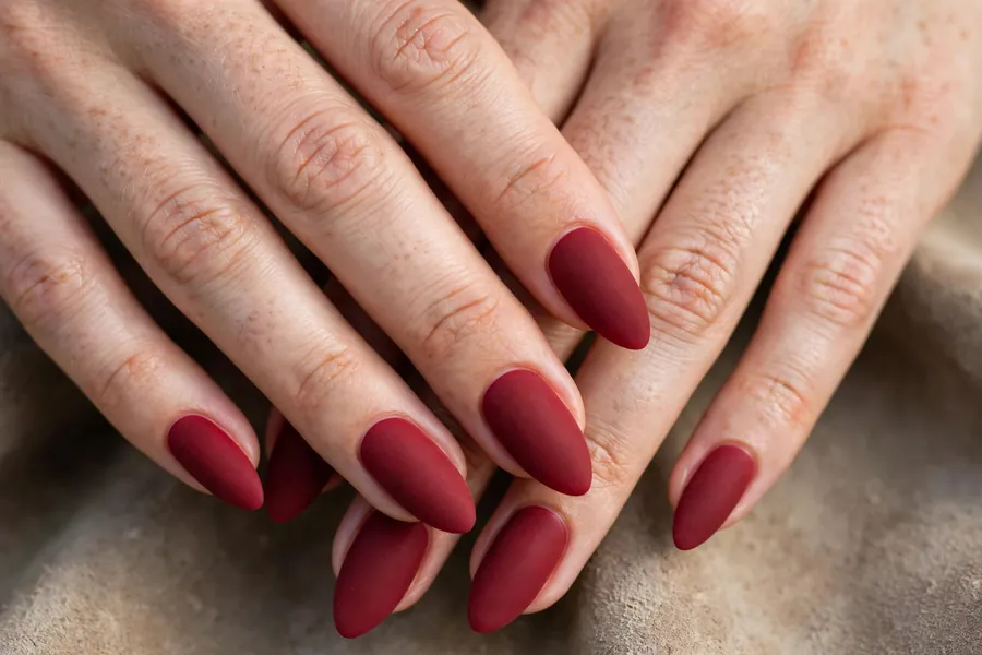 Matte cranberry nails on almond shaped nails