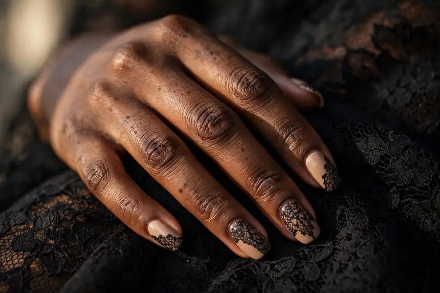 Black lace Valentine's Day nails with lace pattern over nude