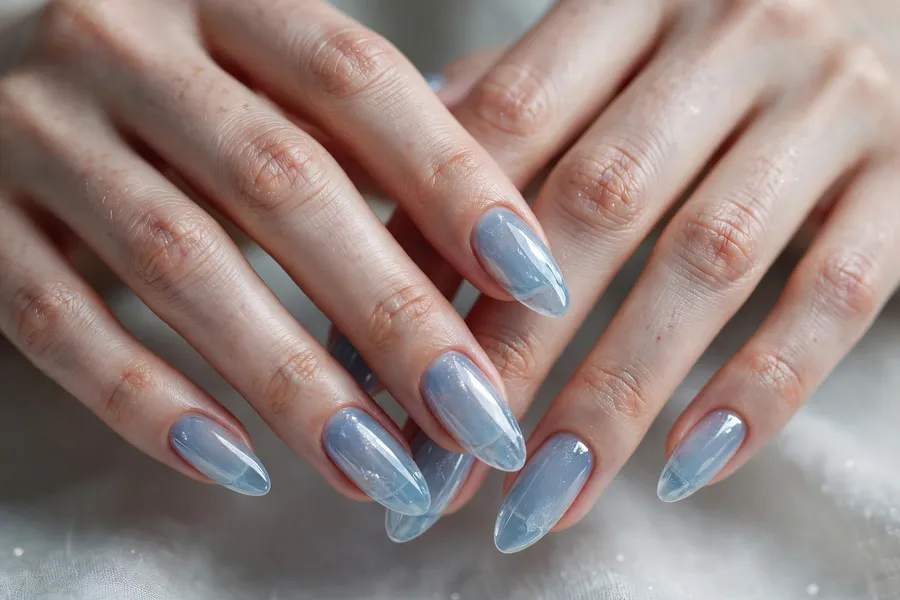 Pale blue ice glass nails on real hands