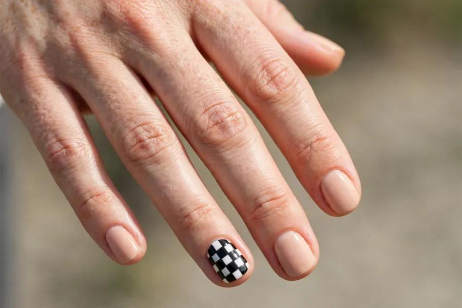 Checkerboard accent short nail designs on real hands