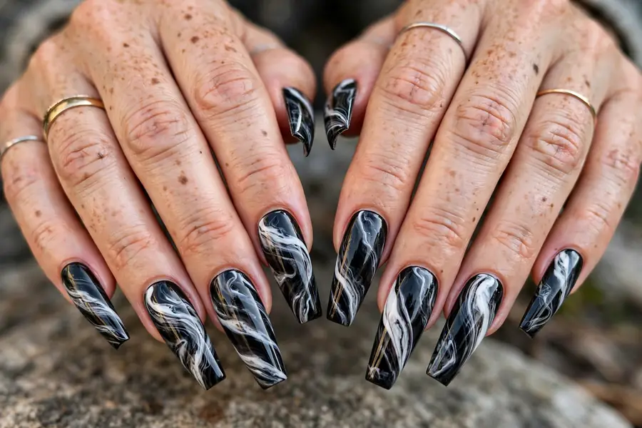 Long coffin nails with dramatic black and white marble swirls