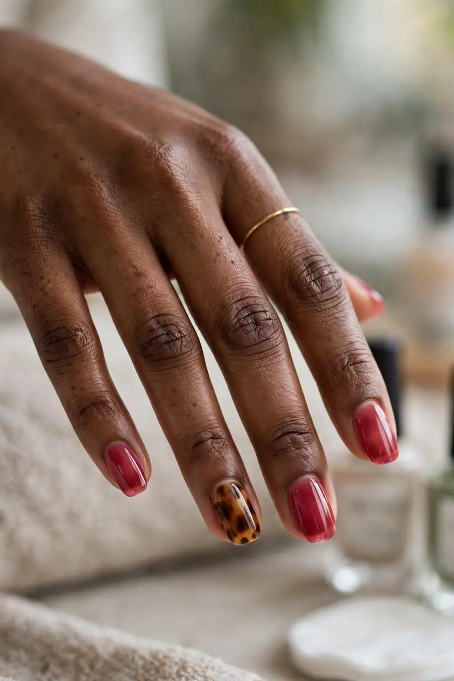 Raspberry jelly nails with a tortoiseshell accent nail