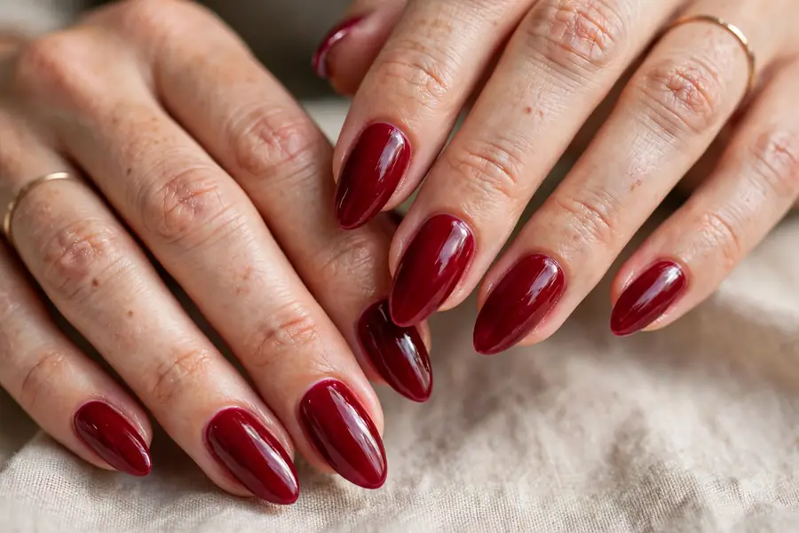 Glossy cranberry nails on almond shape