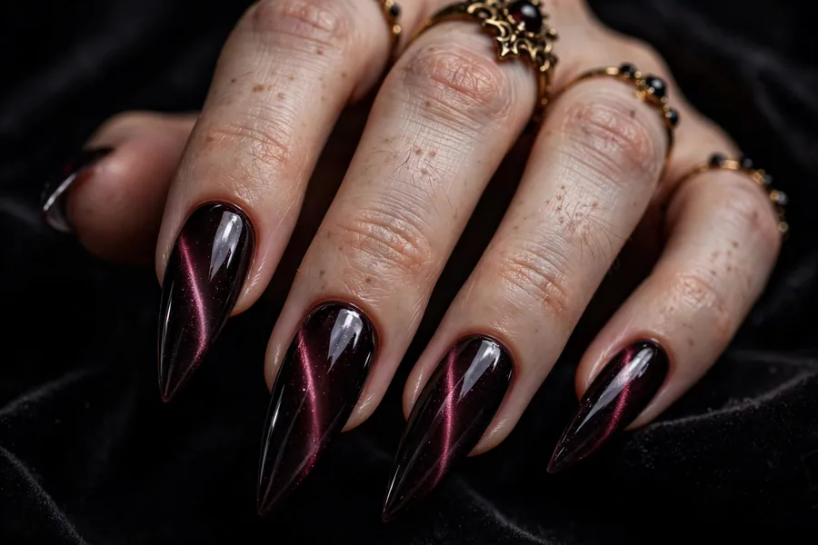 Dark red cat eye stiletto nails