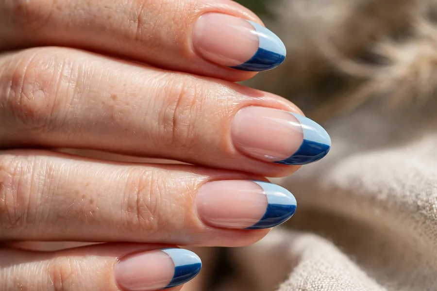 Two-tone light and dark blue French tips