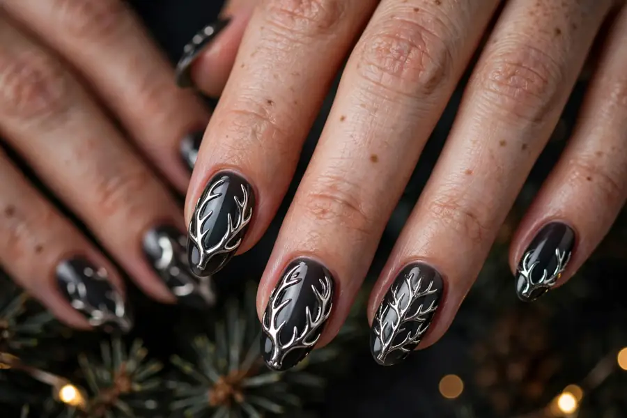 Chrome antler reindeer nails with a shiny metallic finish on real hands