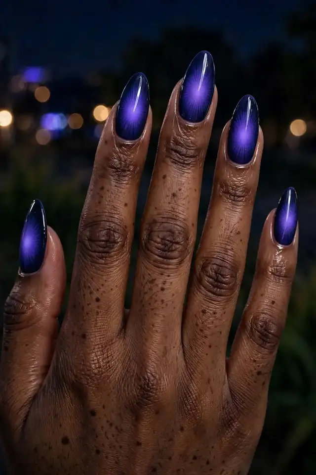Indigo night aura nails with deep indigo and violet glow